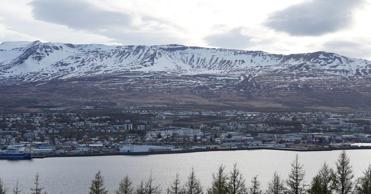 Akureyri, Iceland, from above, below snow-capped mountains