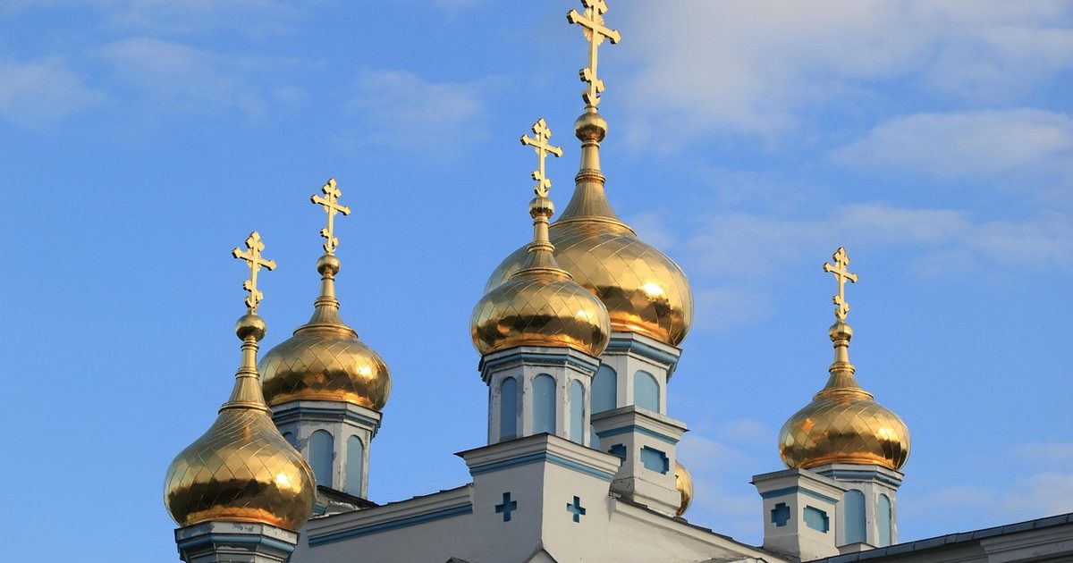 The gold onion domes of an Orthodox church in Daugavpils, Latvia