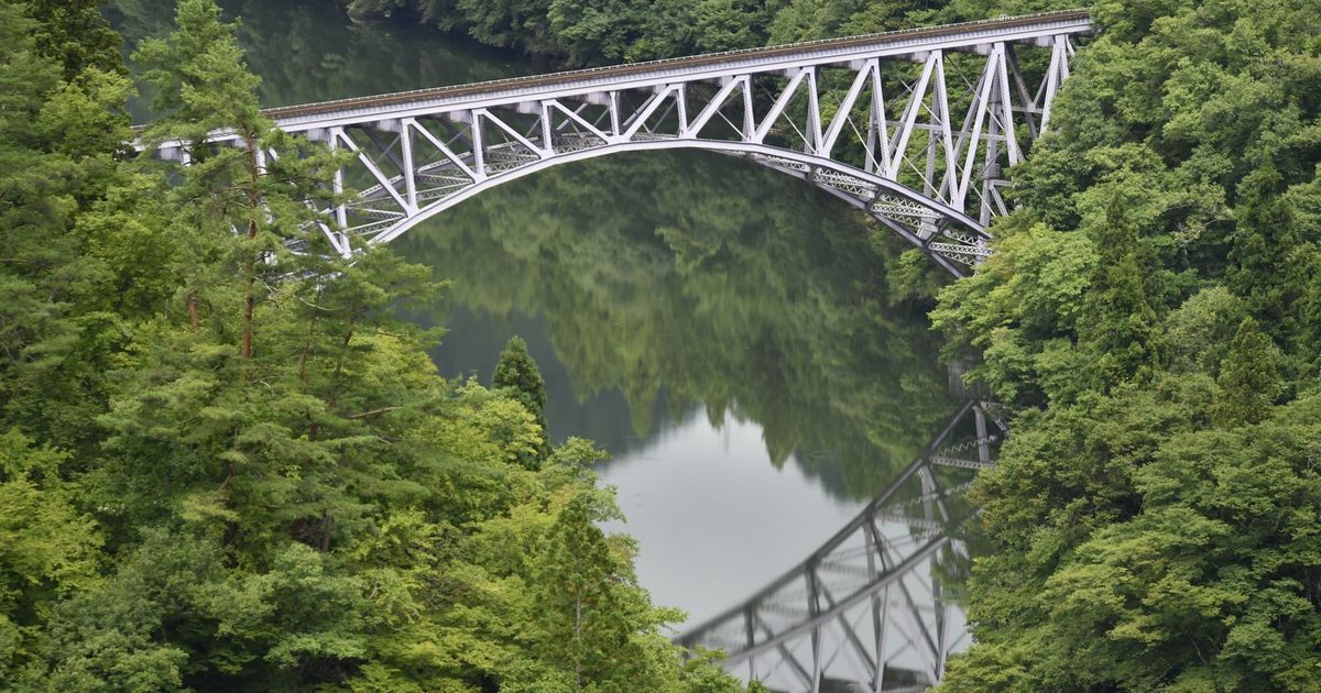 A steel bridge over a forest river in Mishima, Fukushima, Japan