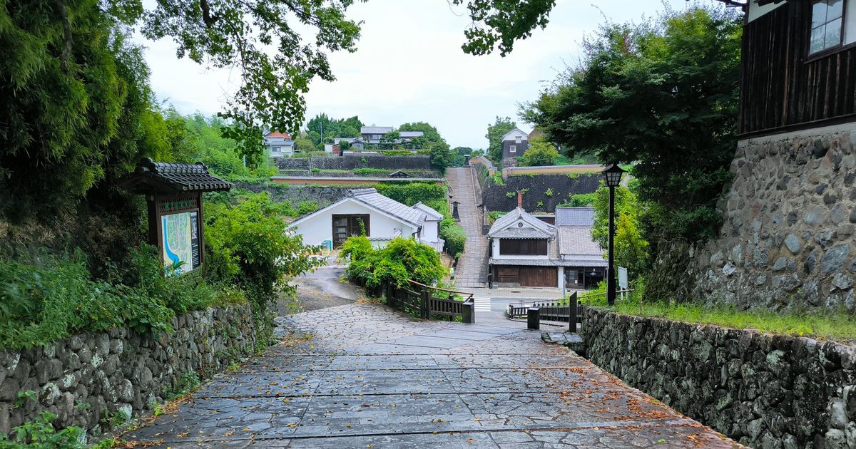 A traditional stone path among greenery in Oita, Japan